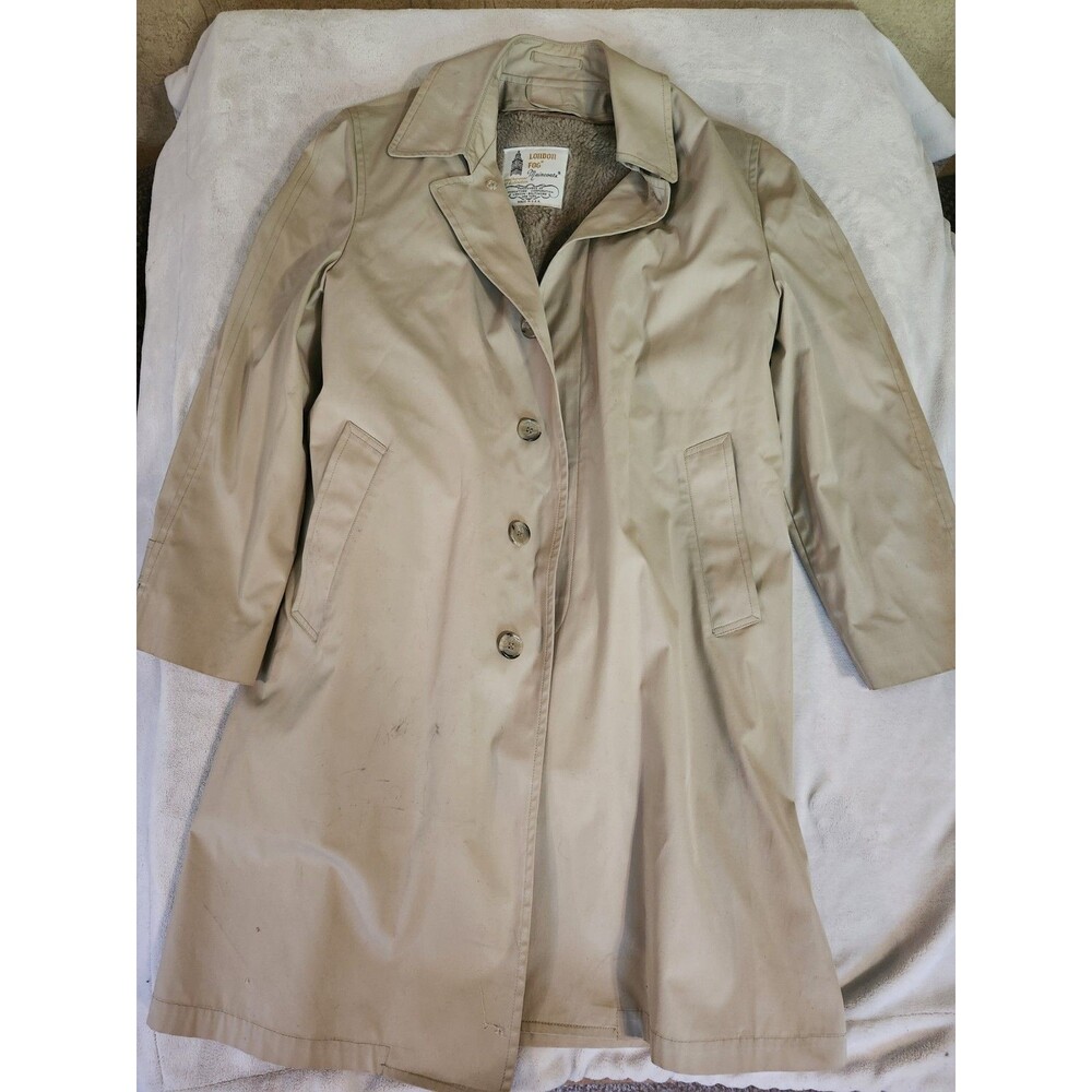 vintage beige London Fog lined trench coat featuring a classic button-front...